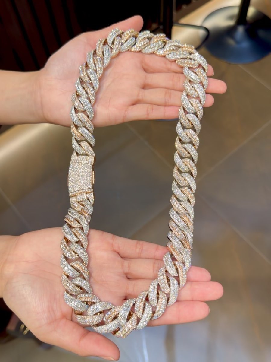 22mm two-tone Blaster Cuban chain held in two hands