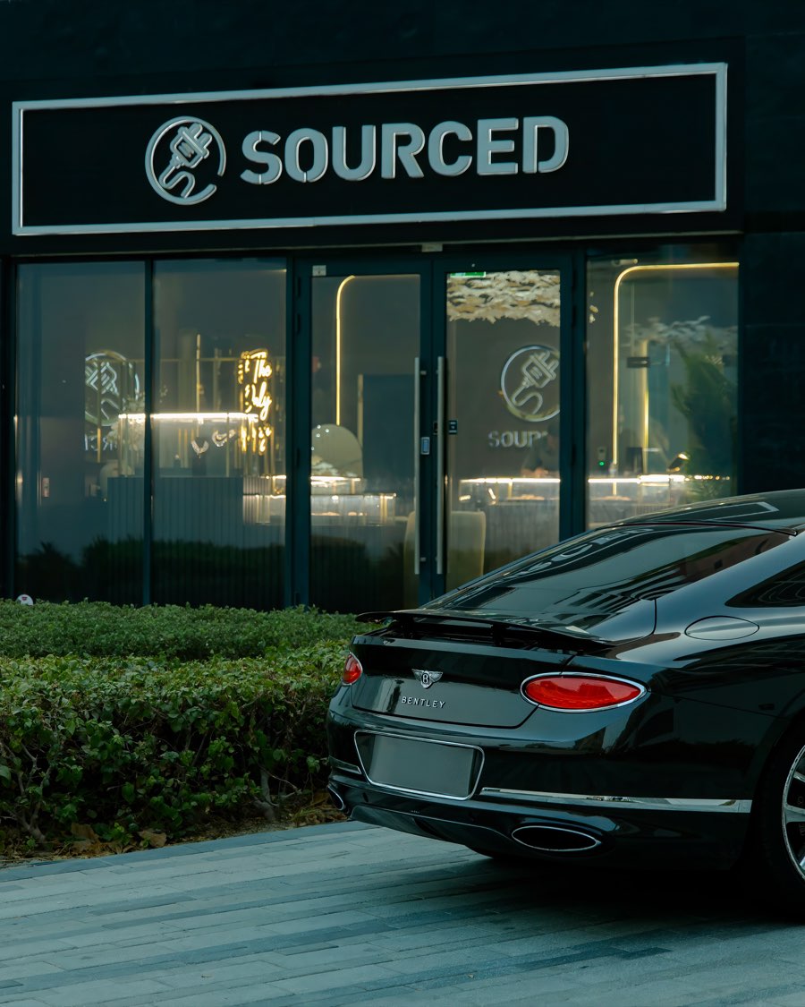 Sourced Dubai storefront with a car parked outside